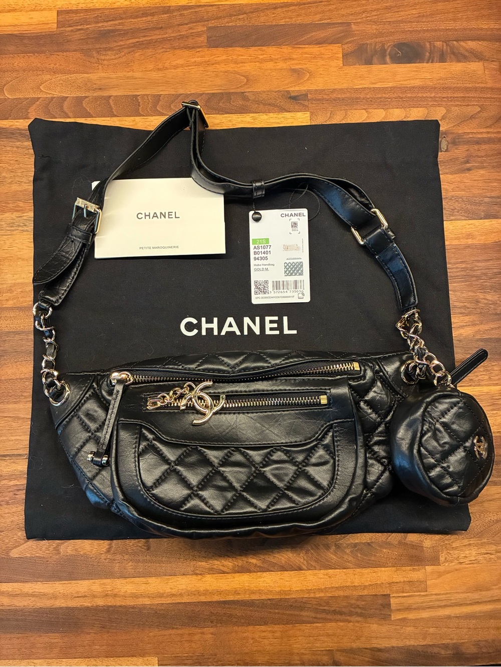 CHANEL Black Quilted Leather Crossbody with Gold Chain Accents